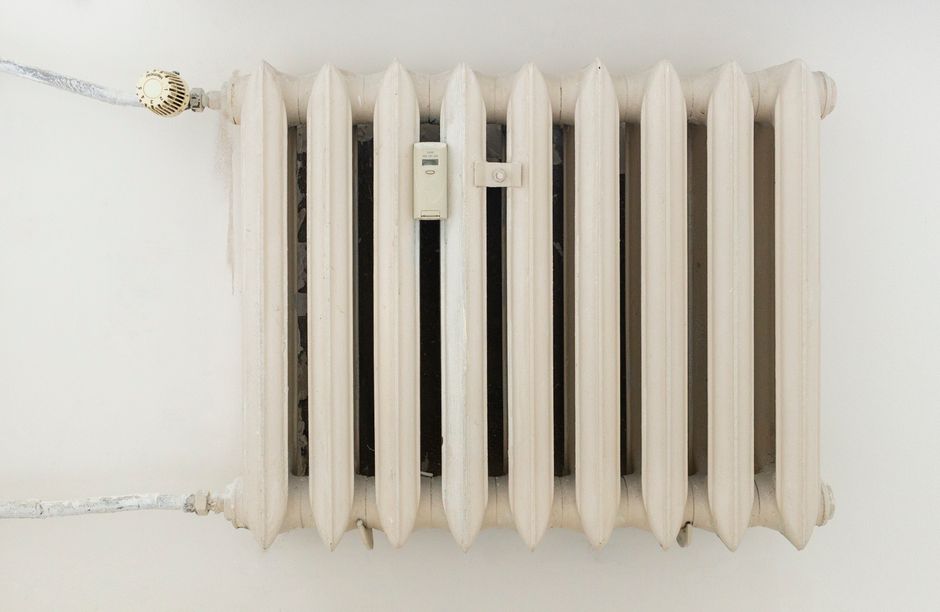 HVAC Blog 6 tankless water heater mounted on wall in modern home